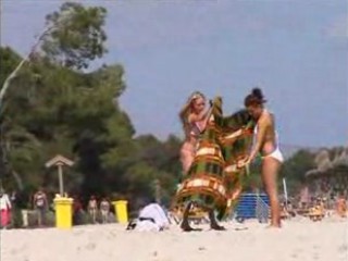 Two topless lesbo girls on the beach